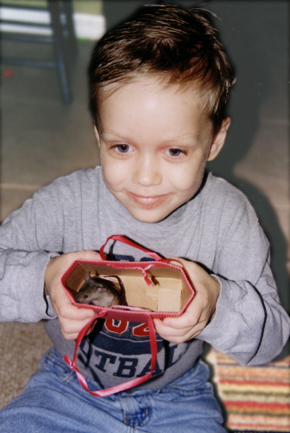 Luke with his new pet mouse, Rascal